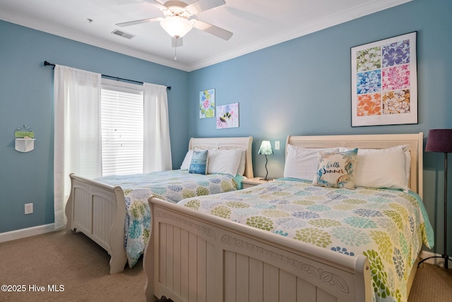 bedroom with light carpet, a ceiling fan, baseboards, visible vents, and crown molding