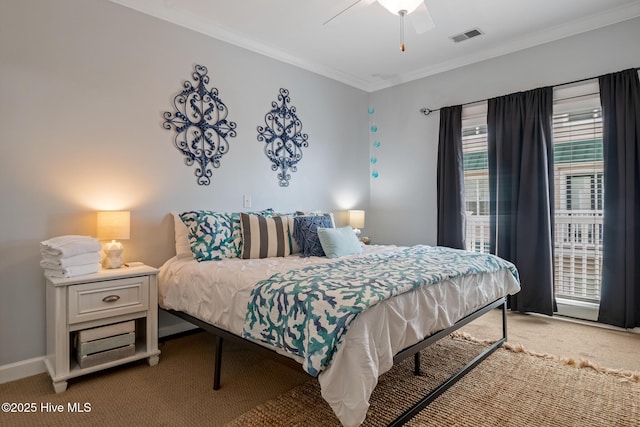 bedroom featuring light carpet, a ceiling fan, baseboards, visible vents, and crown molding