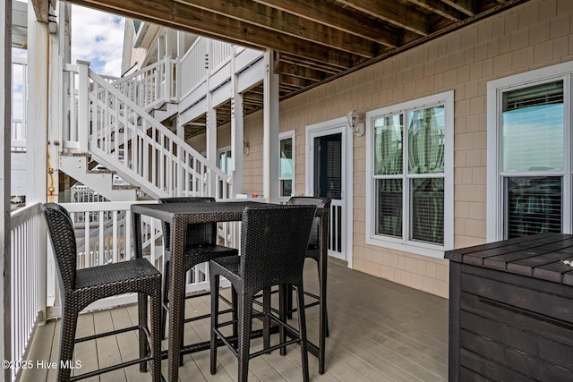 view of patio / terrace featuring stairway and a deck