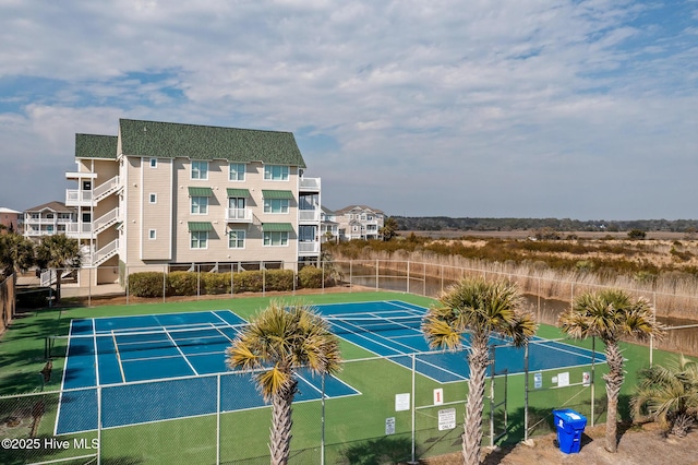 view of sport court featuring fence