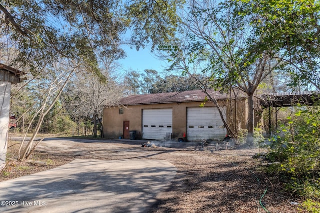 garage featuring driveway