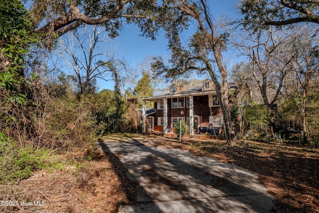 greek revival inspired property with covered porch