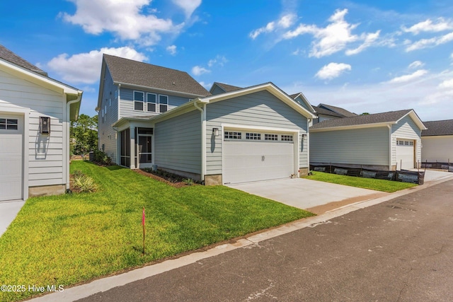 view of front of home featuring a garage, concrete driveway, and a front lawn