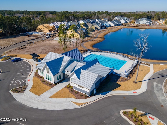 aerial view featuring a water view and a residential view