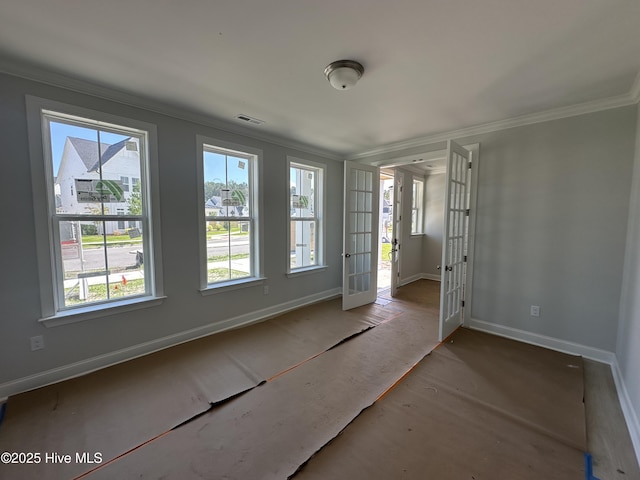 3805 Mason Port Dr Unit 95, Wilmington, NC 28409 - spare room with crown molding, baseboards, and french doors