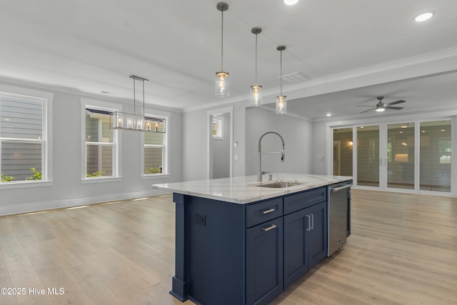 kitchen featuring light wood-type flooring, dishwasher, open floor plan, and a sink