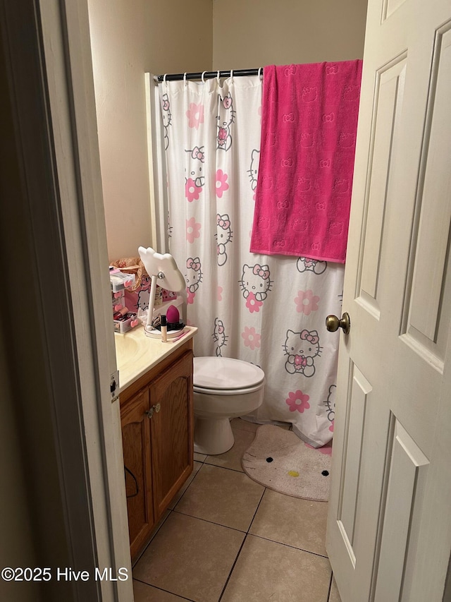 full bathroom with vanity, a shower with shower curtain, tile patterned flooring, and toilet