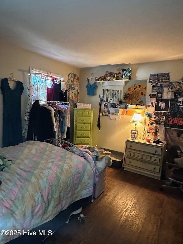 bedroom with wood finished floors