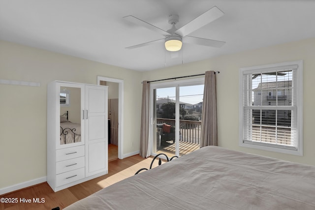 bedroom with access to exterior, ceiling fan, baseboards, and wood finished floors