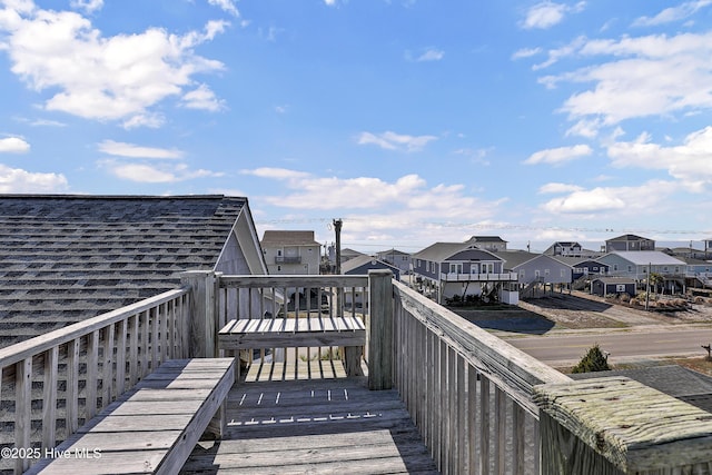 wooden terrace with a residential view