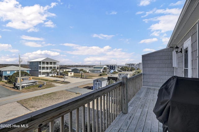 balcony with a residential view and grilling area