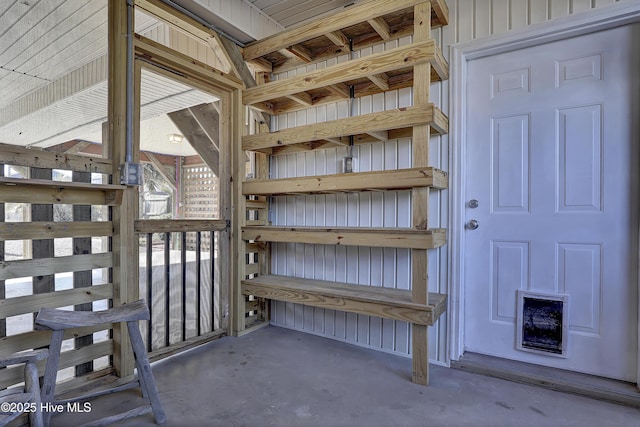 view of exterior entry featuring board and batten siding