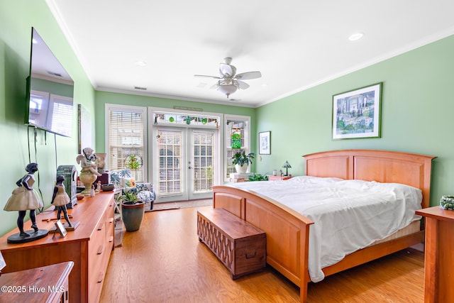 bedroom with access to exterior, light wood-type flooring, french doors, and crown molding