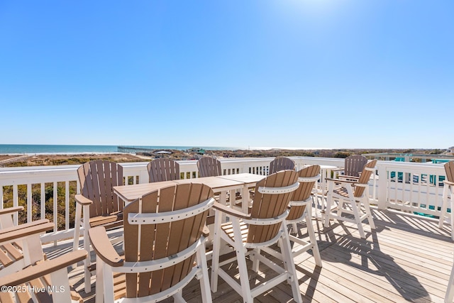 wooden deck with a water view