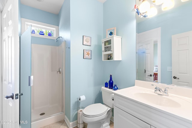 full bathroom with a stall shower, vanity, and toilet