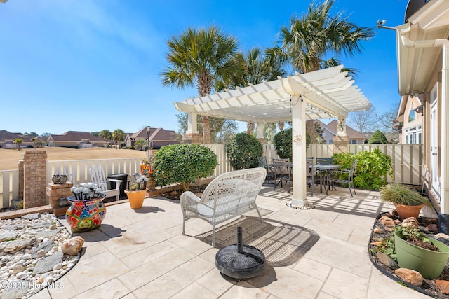 view of patio featuring a fenced backyard, outdoor dining area, and a pergola