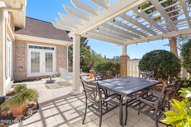 view of patio / terrace featuring outdoor dining space, french doors, and a pergola