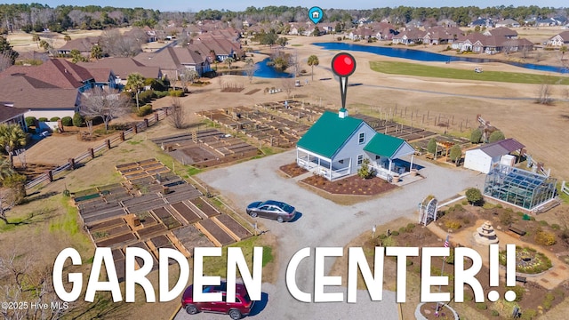 birds eye view of property with a residential view