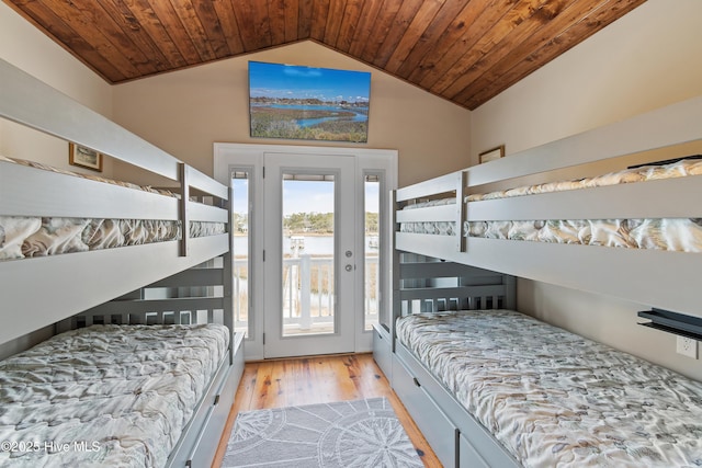 bedroom featuring access to outside, wood ceiling, lofted ceiling, and wood finished floors