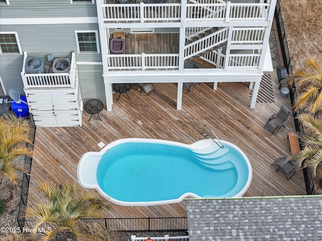 view of swimming pool with stairs