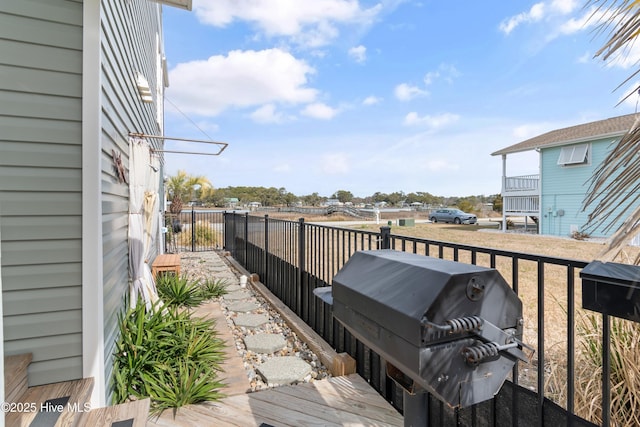 wooden deck with grilling area