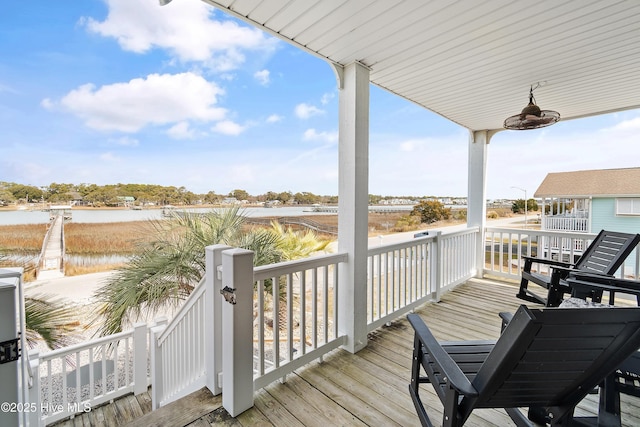 wooden terrace with a water view