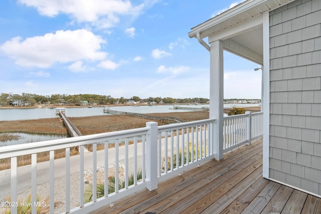 wooden deck featuring a water view