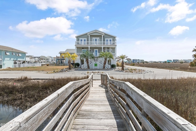 back of property featuring a balcony