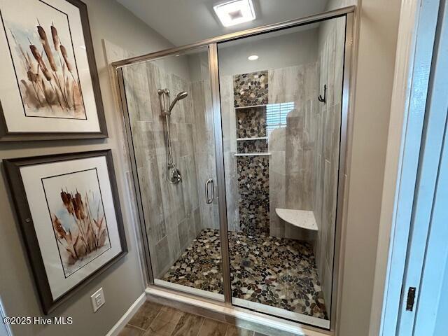 full bathroom with a shower stall