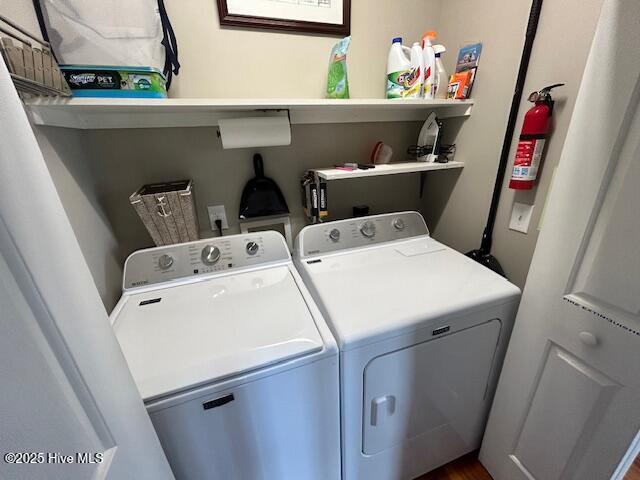 laundry room featuring washer and dryer and laundry area