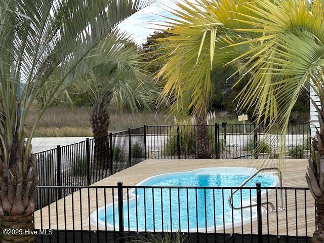 view of pool featuring a fenced in pool and fence