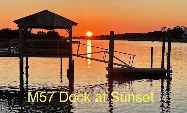 dock area with a water view and a gazebo