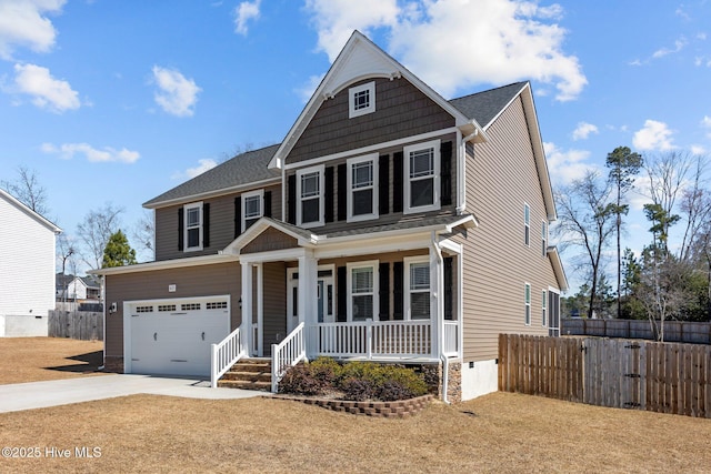 view of front of property with driveway, an attached garage, fence, and a porch