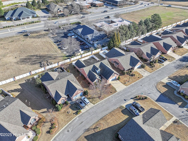 birds eye view of property with a residential view