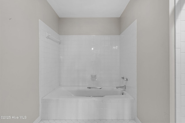 bathroom with tiled bath