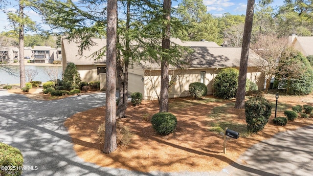 view of front of house featuring roof with shingles