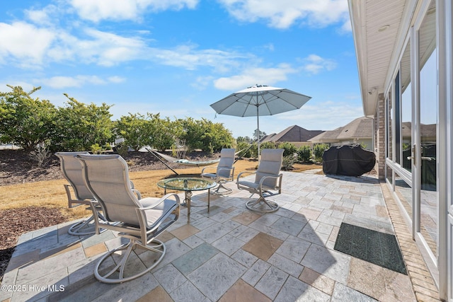 view of patio featuring a grill