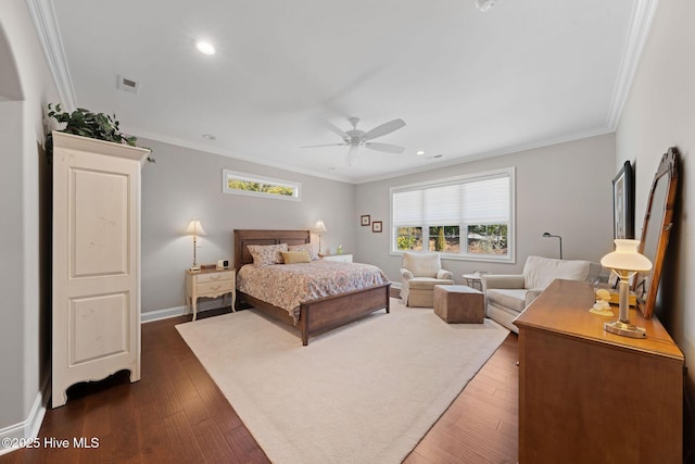 bedroom with baseboards, ornamental molding, and dark wood-style flooring