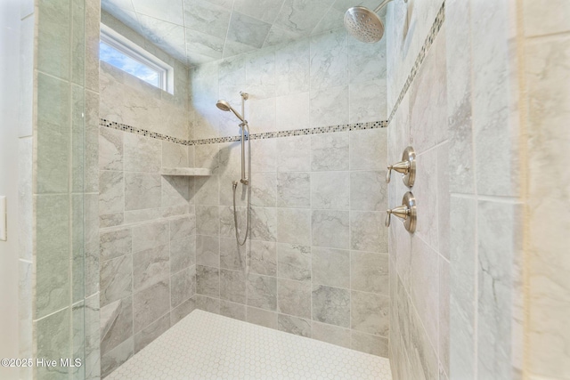 bathroom with tiled shower