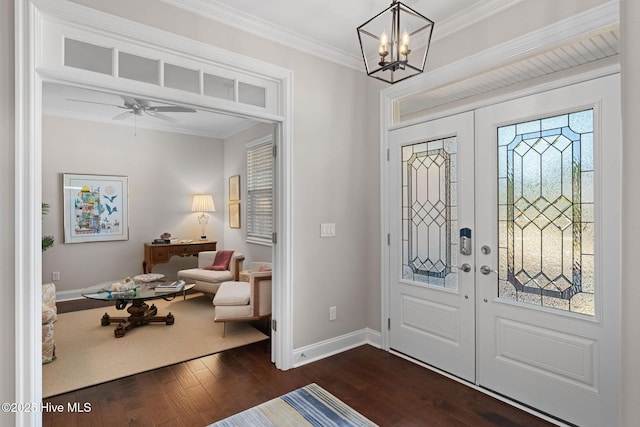 entrance foyer with ornamental molding, french doors, dark wood-style flooring, and baseboards