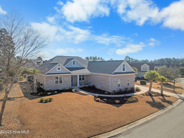 traditional-style home featuring brick siding