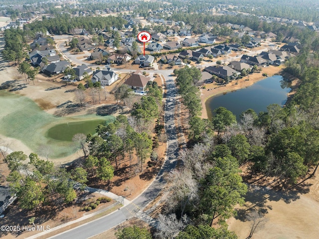 birds eye view of property with a water view and a residential view