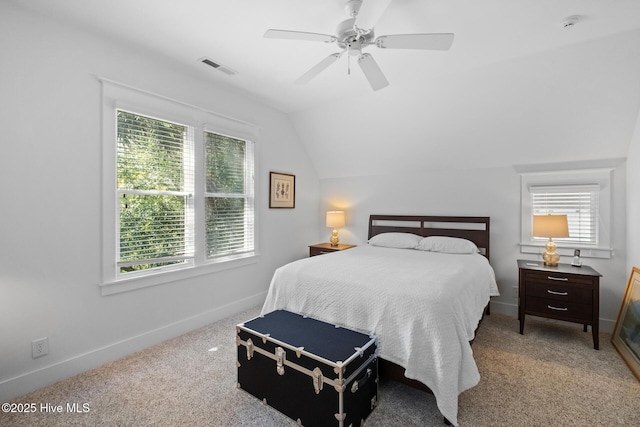 bedroom with baseboards, visible vents, a ceiling fan, lofted ceiling, and carpet flooring