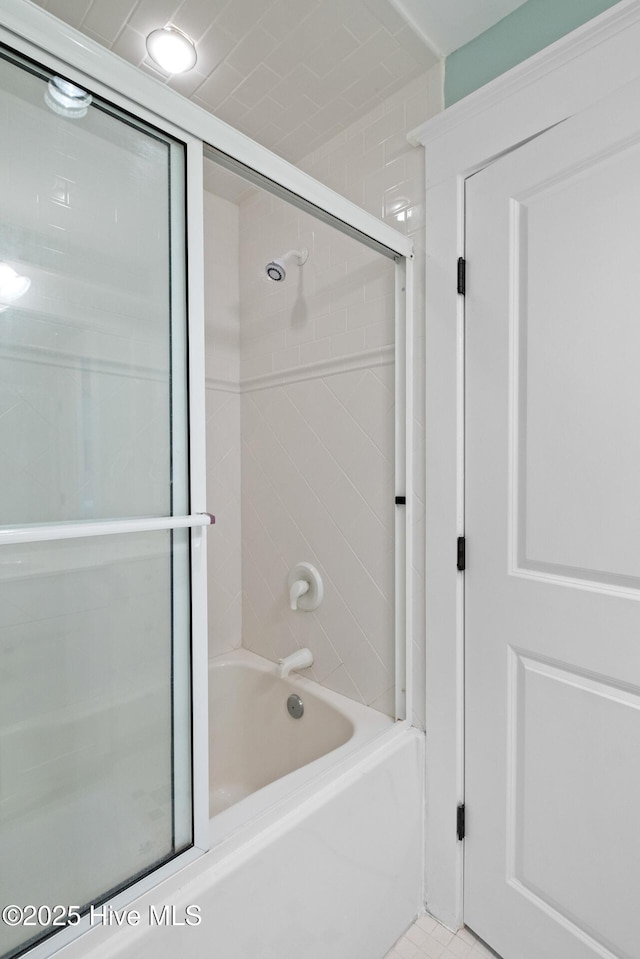 full bathroom with bath / shower combo with glass door