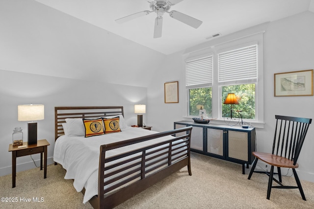 bedroom with baseboards, visible vents, a ceiling fan, vaulted ceiling, and carpet floors