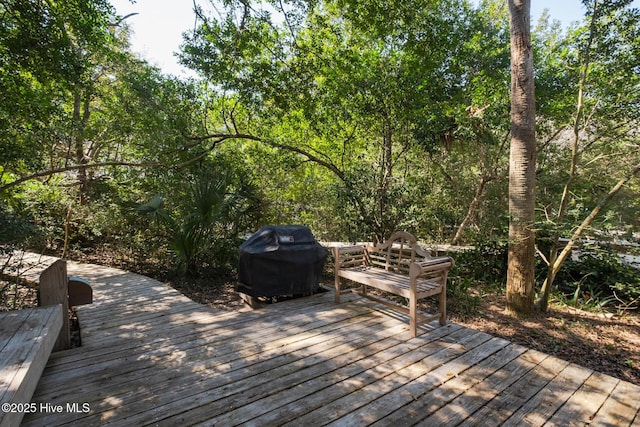 wooden terrace with a grill