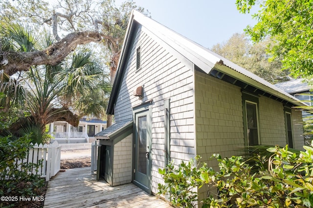 view of side of home featuring a wooden deck