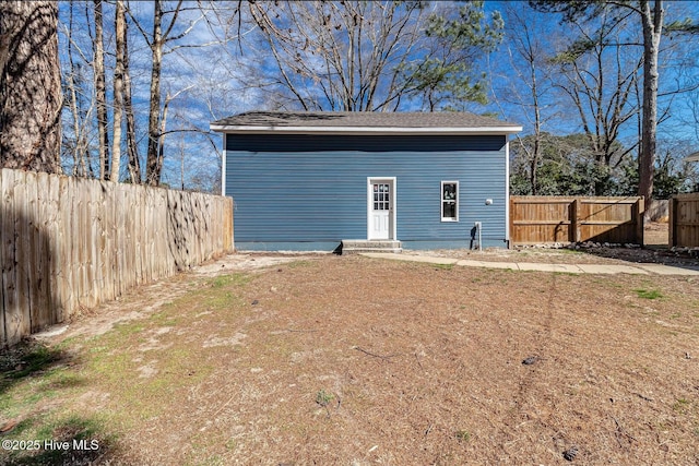 view of outdoor structure featuring a fenced backyard