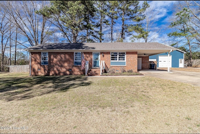 single story home featuring driveway, crawl space, fence, a carport, and a front yard