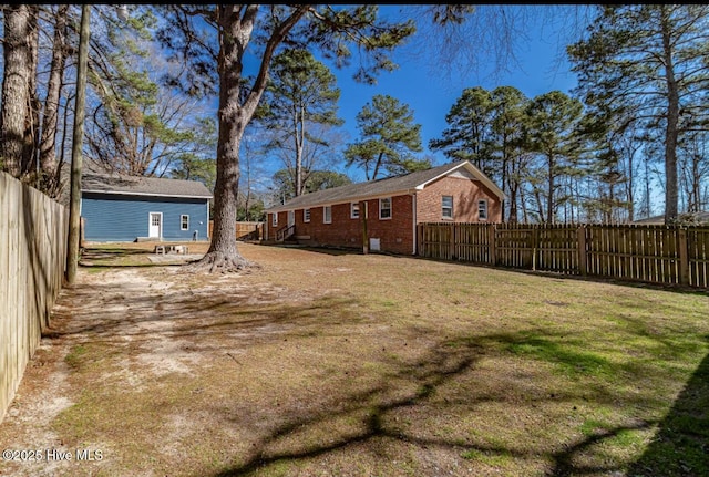 view of yard with a fenced backyard